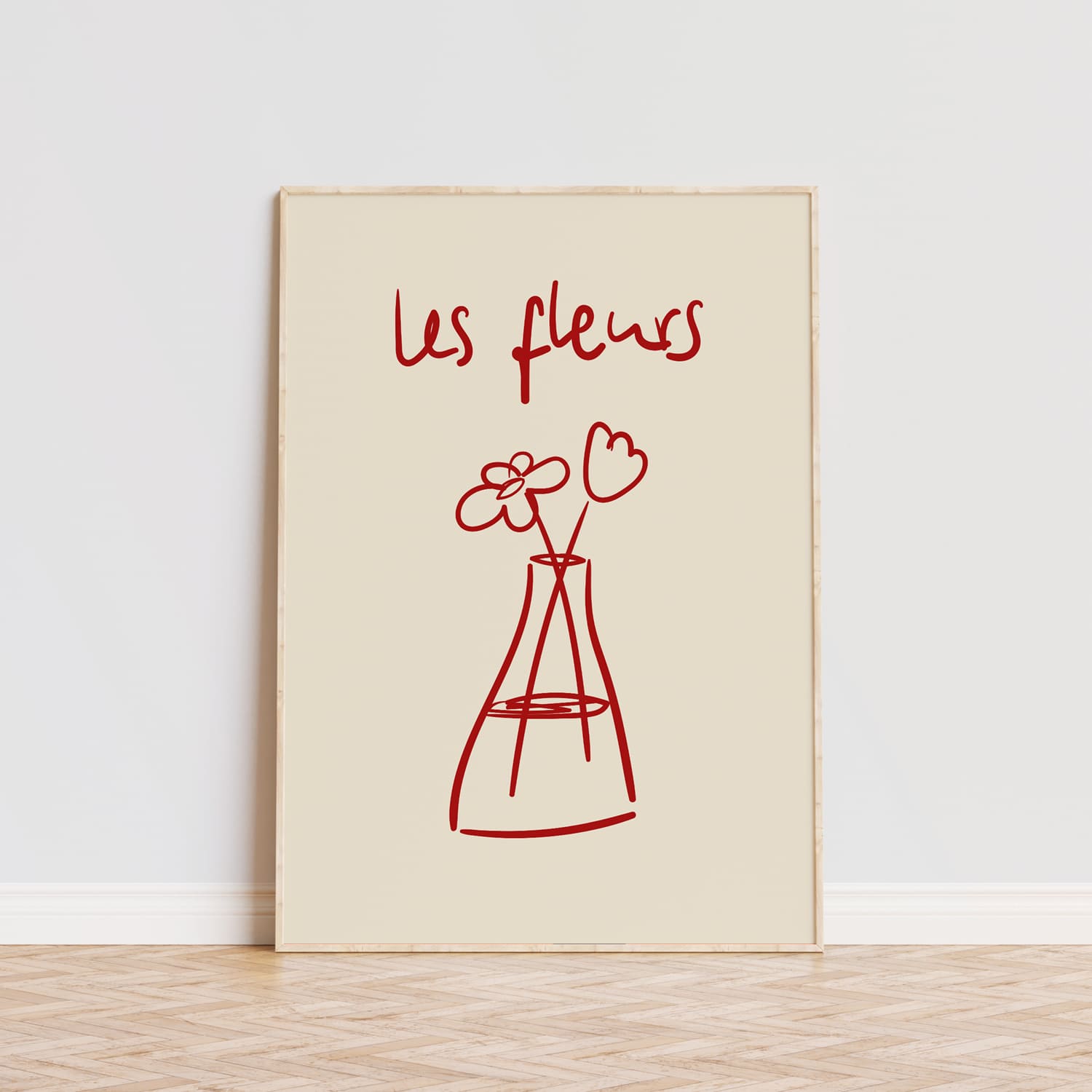 Lámina decorativa minimalista con un dibujo en rojo de dos flores sencillas dentro de un florero estilizado, acompañado del texto en francés 'Les fleurs' en tipografía manuscrita, todo sobre un fondo beige suave. Este diseño elegante y moderno es ideal para decorar espacios como salas de estar, dormitorios o estudios, aportando un toque artístico y poético. Perfecto para amantes del arte sencillo y la decoración con inspiración francesa. Disponible en varios tamaños y colores.